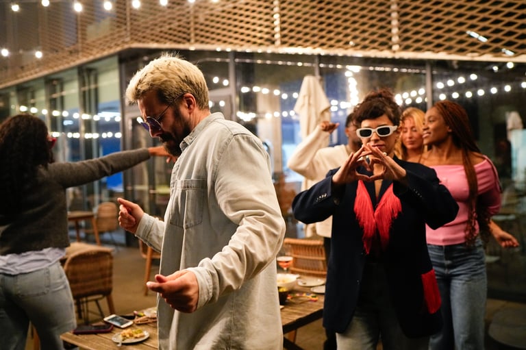 Friends dancing and having fun at lively social party