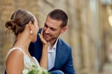 Bride and groom sharing a romantic smile on their wedding day