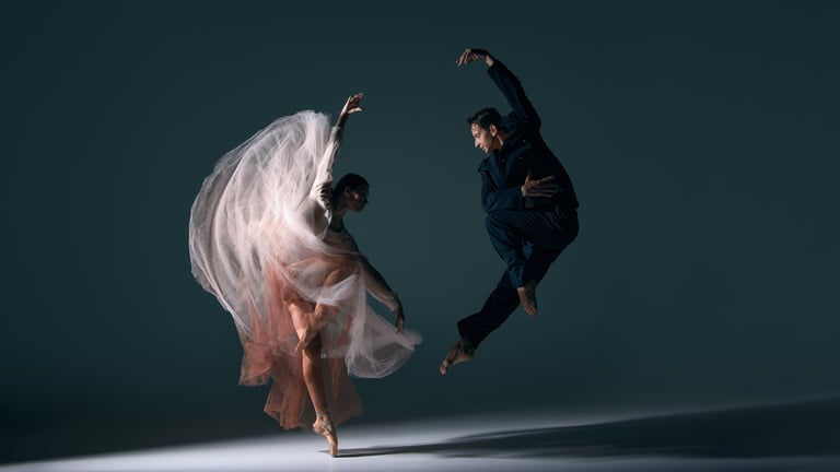 Dance couple performing a dramatic synchronized movement